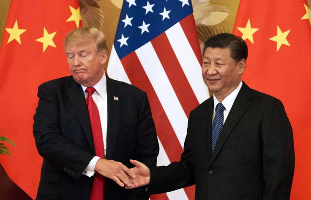 FOTO: La guerra comercial también tiene botón rojo y China amenaza