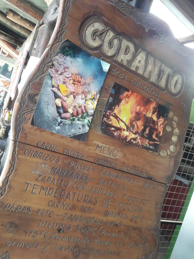 Cocción del curanto, tradición milenaria en Colonia Suiza